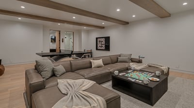 Family room on lower level with ping pong, wall scrabble, and TV