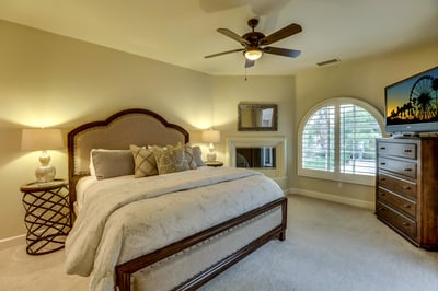 Casita bedroom with king bed, TV, sink area, private entrance and fireplace