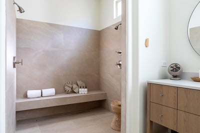 Primary en suite with dual sinks, vanity, large soaking tub and walk-in shower