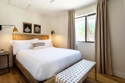 Guest bedroom 3 includes queen bed and smart TV.