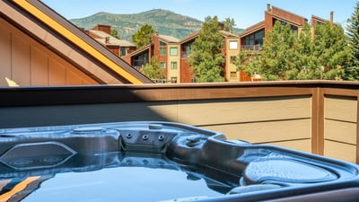 Peek the mountain tops from your private hot tub