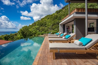 Terrace & Pool: Heated infinity pool (36 m x 12 m) with steps surrounded by a deck terrace. 