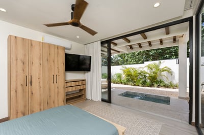 - Slide open your doors to a bubbling private plunge pool and tropical garden views
- Neutral tones,