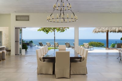 - Dine with breathtaking views where ocean blues meet modern elegance indoors
- Oversized windows op