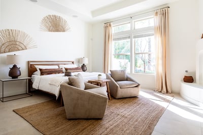 Añejo (primary bedroom suite): king bed, dresser, smart TV, fireplace and coffee/tea bar