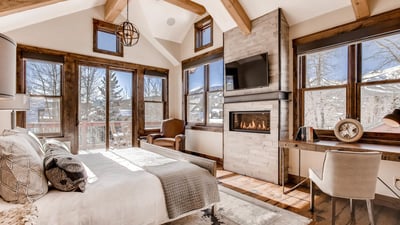 Primary suite on upper level with fireplace
