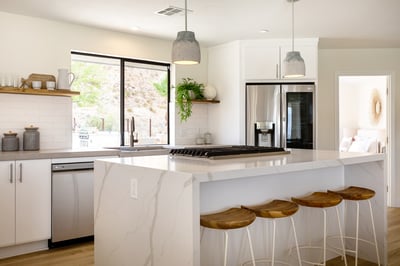 Waterfall marble counter tops show the luxury and detail exemplified through out the newly remodeled
