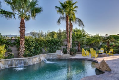 Large pool with tanning shelf and calming waterfalls