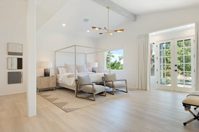 Primary en-suite with private patio access and large walk-in closet