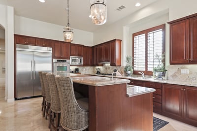 Chef's kitchen with casual breakfast bar seating for 4