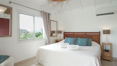 Bedroom 1: King size bed, air conditioning. Ensuite bathroom, private terrace. 