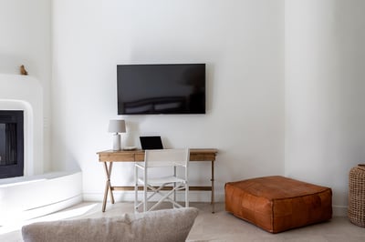 Añejo (primary bedroom suite): king bed, dresser, smart TV, fireplace and coffee/tea bar