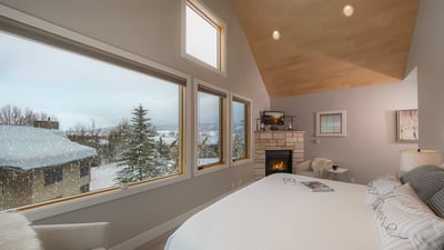 Bedroom 1, Main Level - Primary king bedroom with cozy fireplace