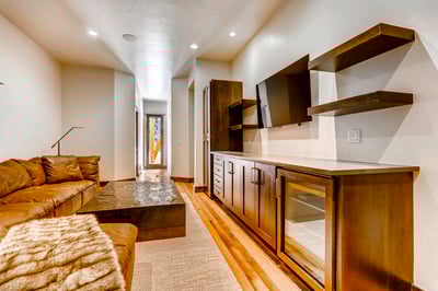 Family room with TV and wine fridge