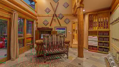 Mudroom on main level with access leading to ski run