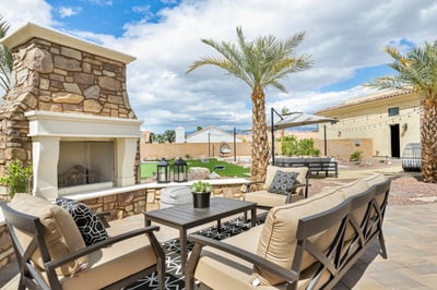 Cozy seating for four by the outdoor fireplace