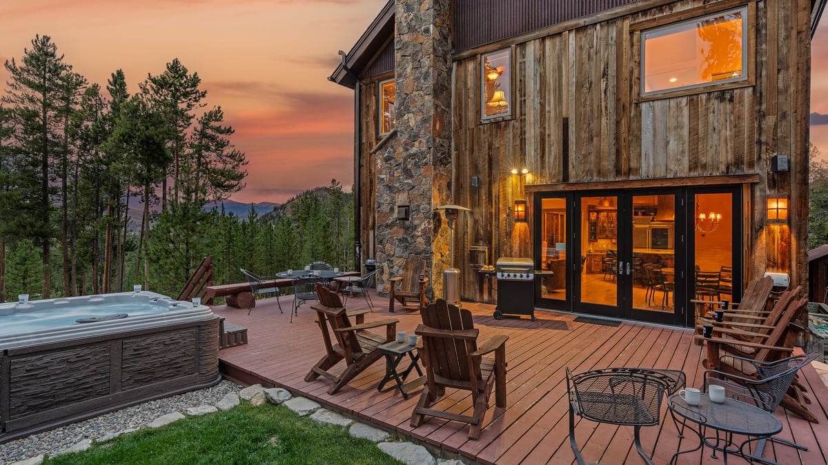 Relax on the back deck with plenty of seating, grill, and hot tub - Image 3