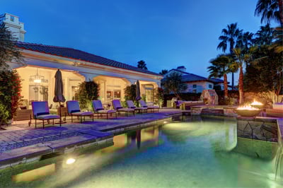 Private, resort-style backyard with fireplace, custom BBQ island, ample seating and al fresco dining