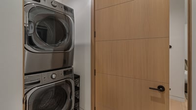 Upper level stacked washer/dryer