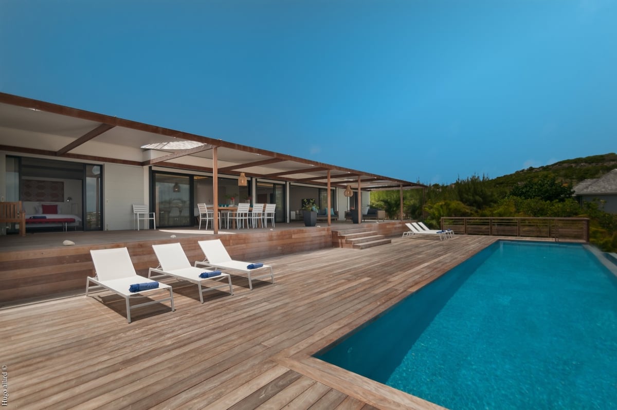 Terrace & Pool: The large terrace has a dining room and an outdoor living room with seating and the  - Image 3