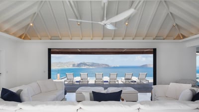 Living Area: Expansive lounge area opening onto the terrace, facing the panoramic views. Air conditi