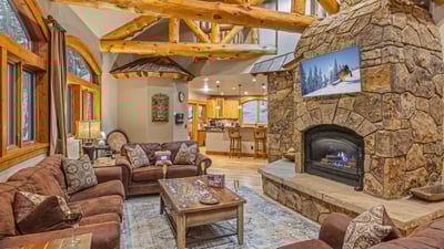 Great room on main level with gas fireplace and TV