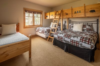Rustic charm meets cozy comfort in this woodland retreat. Four beds and a playful bunk nook.