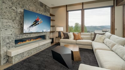 Large sectional in family room with large TV, fireplace