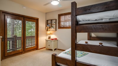 Bunk room on main level with XL twin over queen bunk and twin trundle underneath