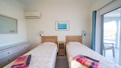 Bedroom 3: Two single beds, air-conditioning, ceiling fans, mosquito net, bathroom with shower, hair