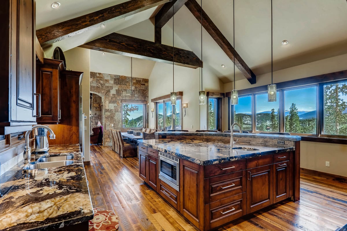 This kitchen features all the right amenities, views, and additional seating - Image 23