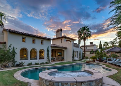 Large Backyard full of amenities such as oversized pool, spa, chaise lounge chairs, fire pit, outdoo