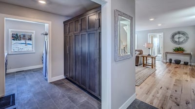 Laundry area with mudroom ski lockers on mid level