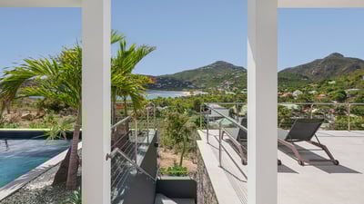 Outdoors: Two-level property, surrounding by a lush tropical garden. Private parking at the ent