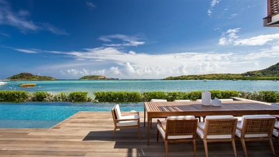 Outdoor Dining Area: Outdoor dining table for twelve people, next to the pool. 