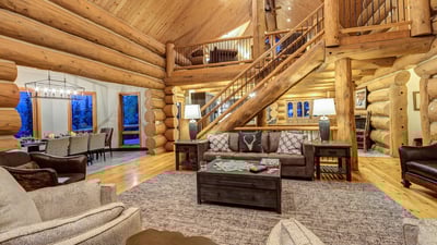 Great room with an open staircase and loft up above