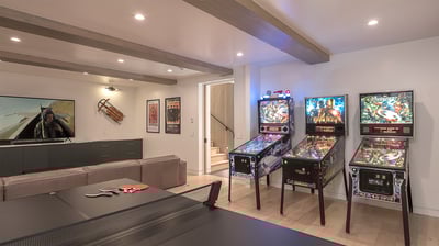 amily room on lower level with ping pong, large tv, and pinball machines