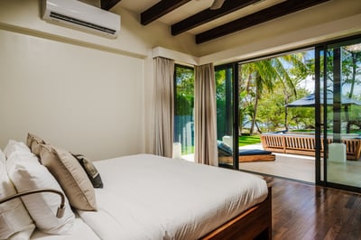 #1. Downstairs, you'll score the first Primary Suite complete with a pool and killer ocean view.