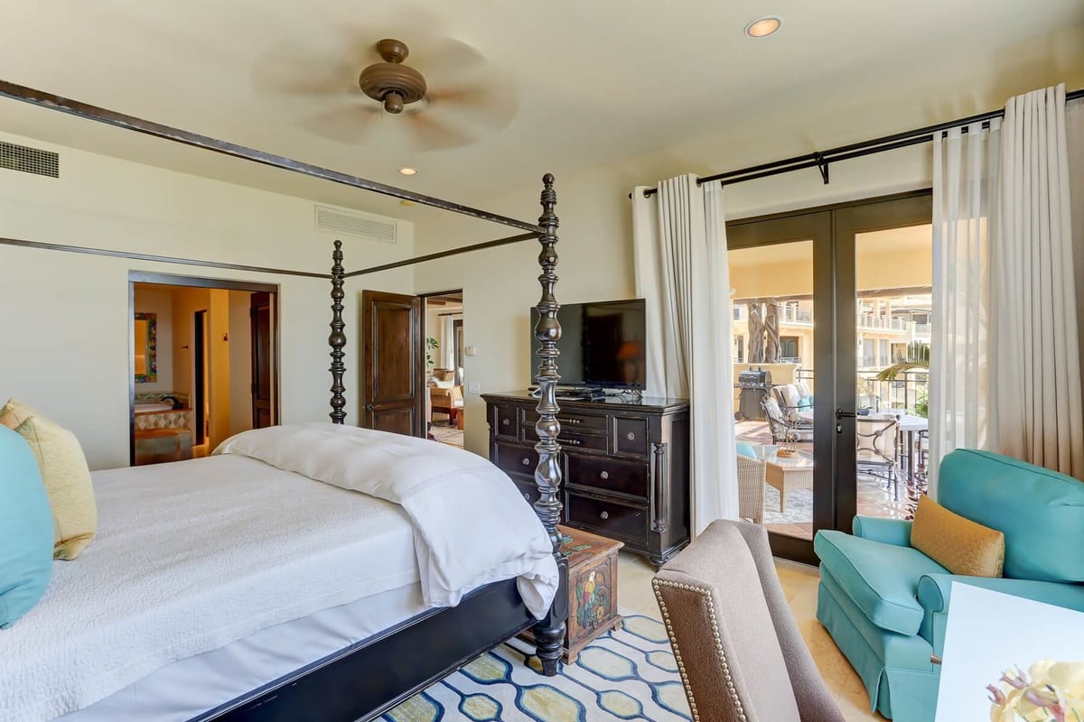 Complete with a TV and French doors that open out to the terrace, the Master Bedroom is another trea - Image 11
