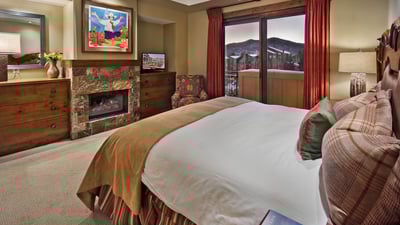 Primary suite with fireplace and TV