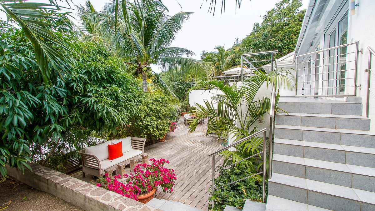 Outdoors: Two-level property, surrounding by a lush tropical garden. Private parking at the entrance - Image 13