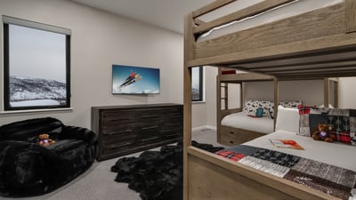 Bunk bedroom on lower level with one twin-over-twin bunk and one full-over-full bunk plus a twin tru