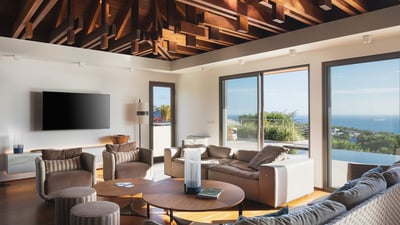 Living Area: Expansive lounge area opening onto the terrace, facing the panoramic views. Air conditi