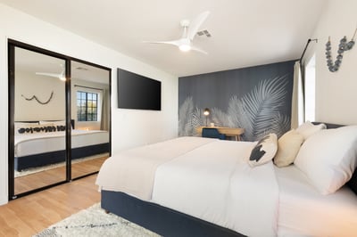 Guest bedroom 5 in the main house with king bed, direct access to the pool, reach-in closet and en s