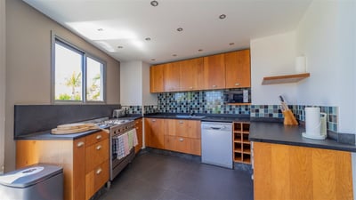 Kitchen & Dining Area: Fully equipped air-conditioned kitchen with electric oven, ceramic hob, micro