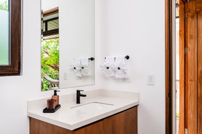 A convenient half bathroom, perfect for quick refreshes.