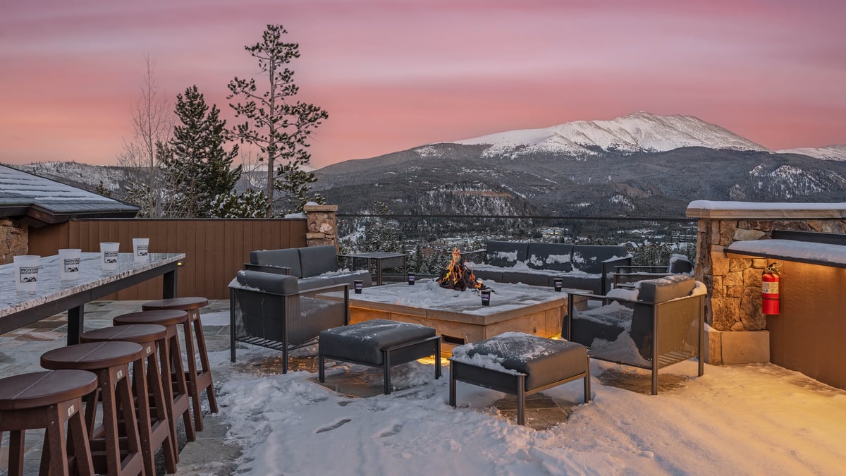 Winter sunset on rooftop patio with gas fire pit - Image 6