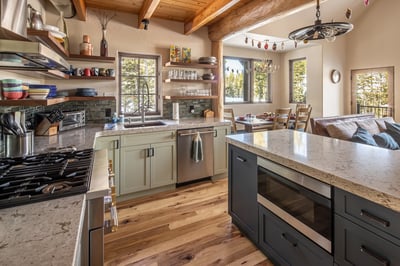 Your spacious kitchen features granite counters, stainless appliances, and rustic beams - perfect fo