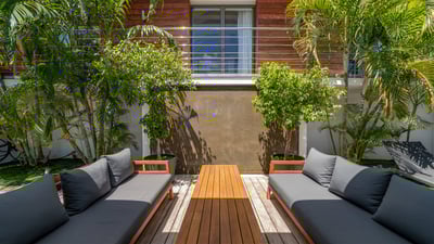 Outdoor Lounge Area: Lounge area on the back of the main building and connected to the bedrooms' bui