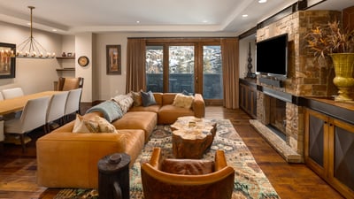 Enjoy the views from the cozy living area with fireplace and TV